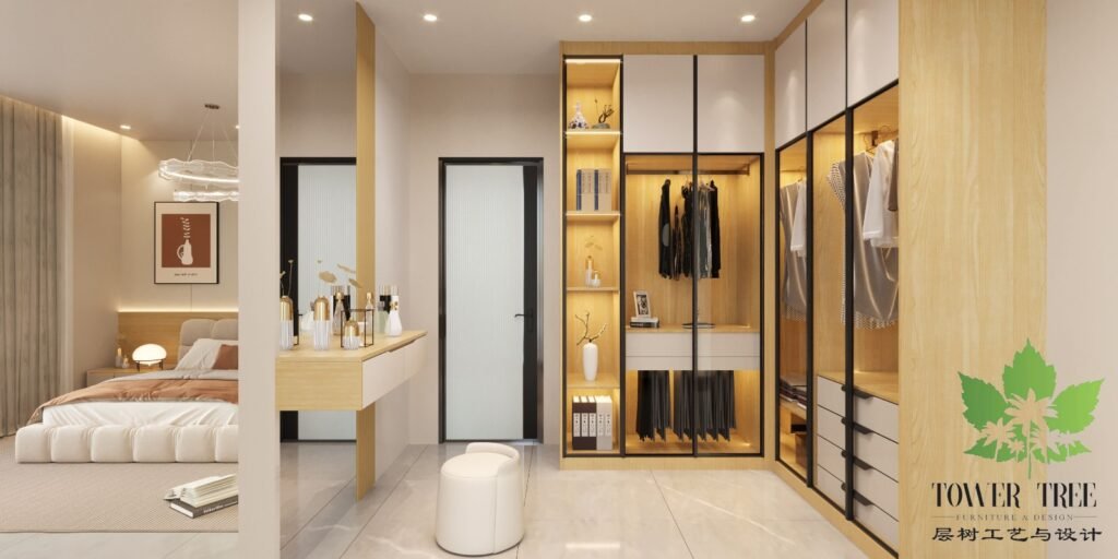 Modern L-shaped custom wardrobe with glass display doors, built-in warm LED lighting, and matching floating vanity table built by Tower Tree Renovation in Johor.
