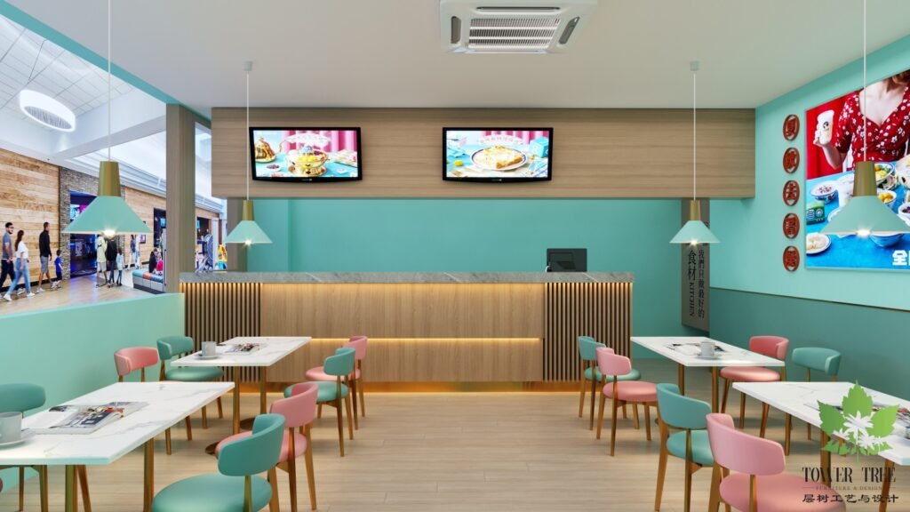Pastel Hong Kong-style dessert cafe interior with mint-green walls, pink and teal dining chairs, marble-top tables, gold accents, and a custom feature wall, designed and built as a one-stop project by Tower Tree Renovation for Jane Deer Dessert in Johor.