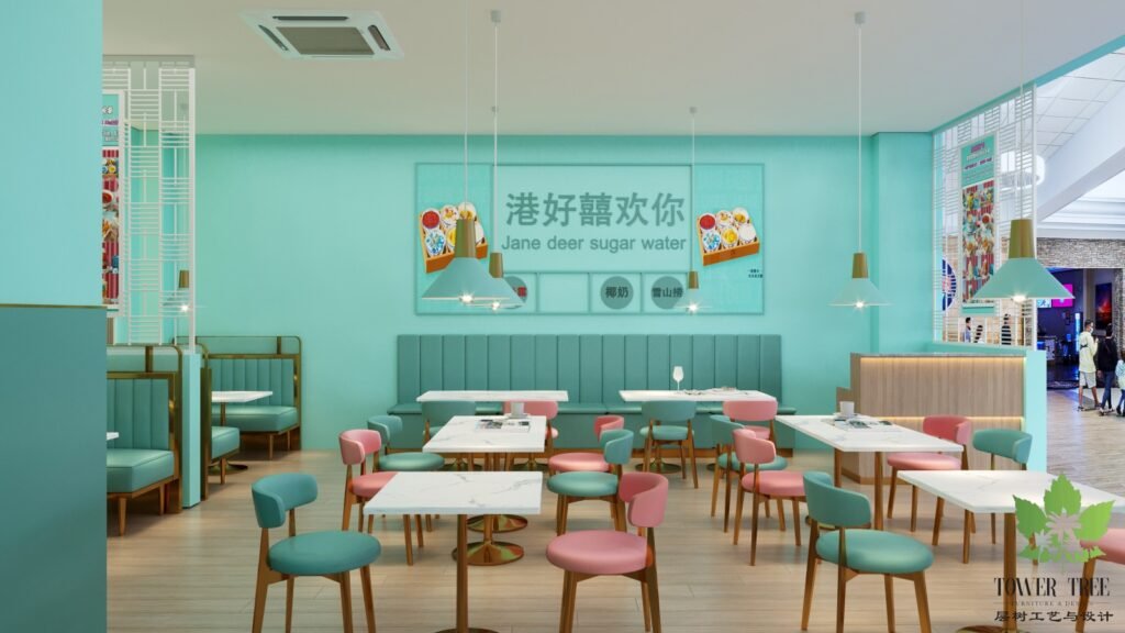 Pastel Hong Kong-style dessert cafe interior with mint-green walls, pink and teal dining chairs, marble-top tables, gold accents, and a custom feature wall, designed and built as a one-stop project by Tower Tree Renovation for Jane Deer Dessert in Johor.