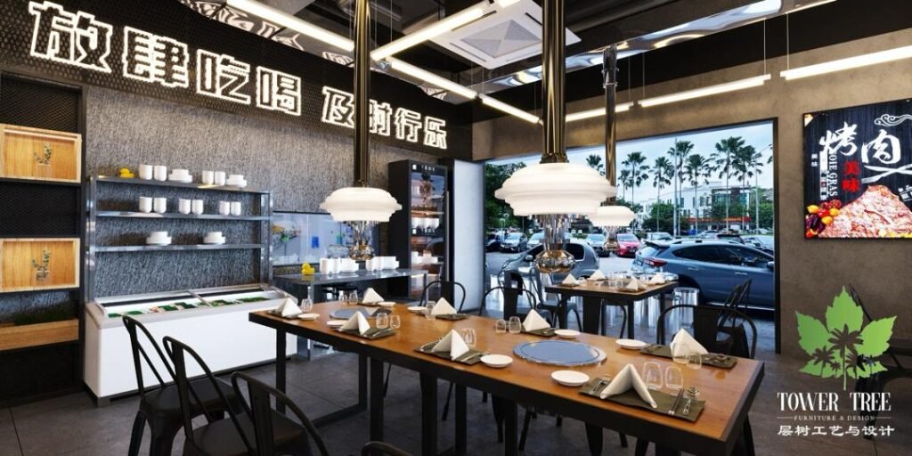Modern Korean BBQ restaurant dining area with custom banquette seating, overhead exhaust hoods, and graphic wall art designed and renovated by Tower Tree Renovation for Sae Ma Eul BBQ in Austin Crest, Johor.